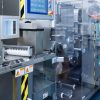 Pharmaceutical factory workers in sterile environment PackStation (SAP)