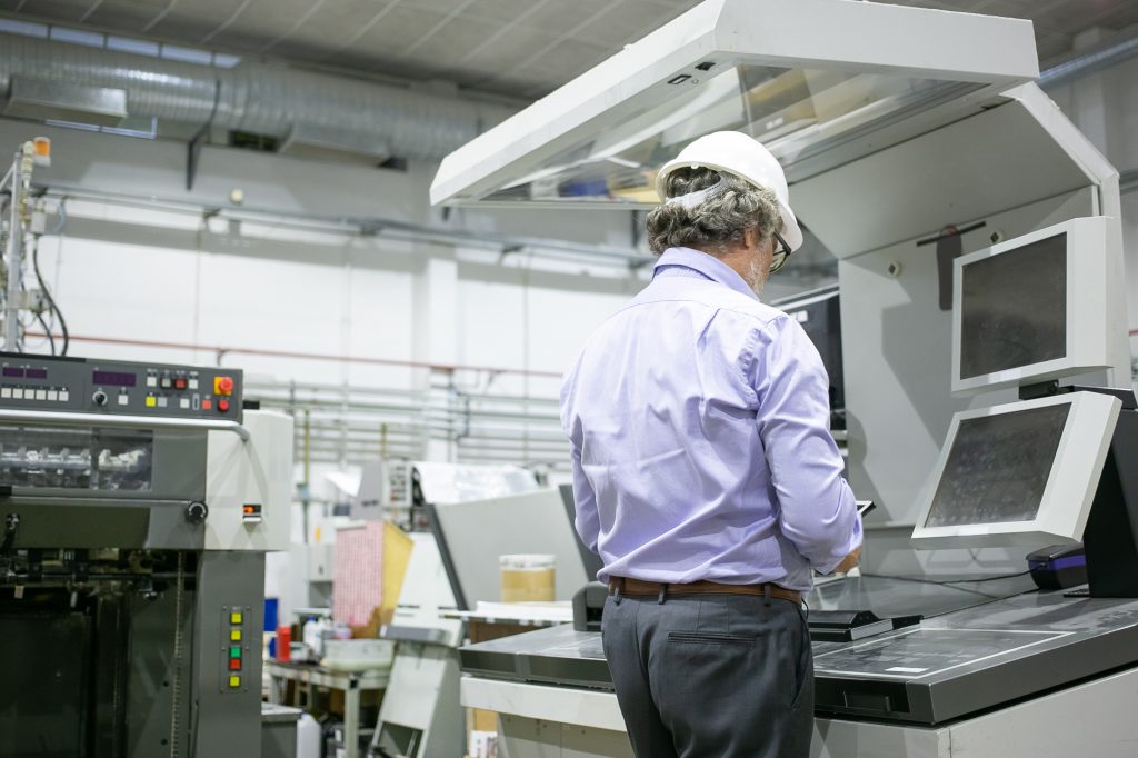 Pharmaceutical factory workers in sterile environment Semi-Automated Print Station (SAPS)