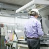 Pharmaceutical factory workers in sterile environment Semi-Automated Print Station (SAPS)