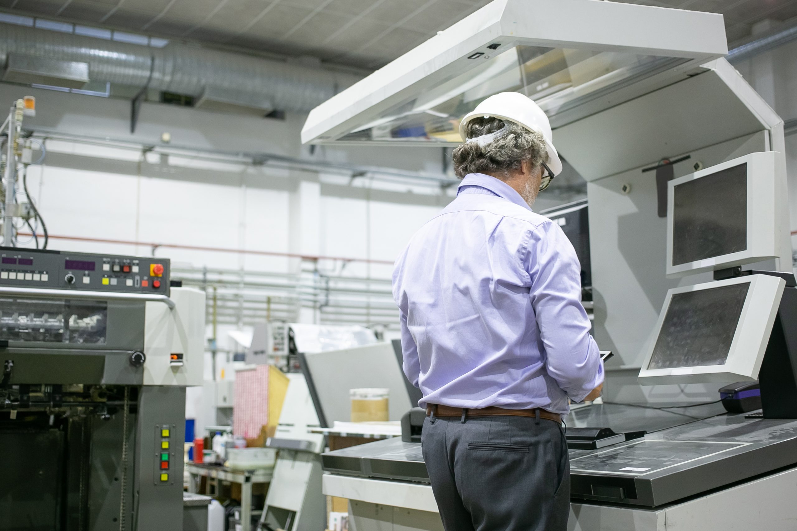 Pharmaceutical factory workers in sterile environment Semi-Automated Print Station (SAPS)